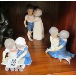 A Royal Copenhagen figure two children, a B & G figure two children reading and another B & G figure