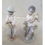 A Lladro figure boy playing drum and another with trumpet