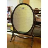 An oval swing mirror