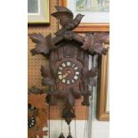 A carved oak cuckoo clock
