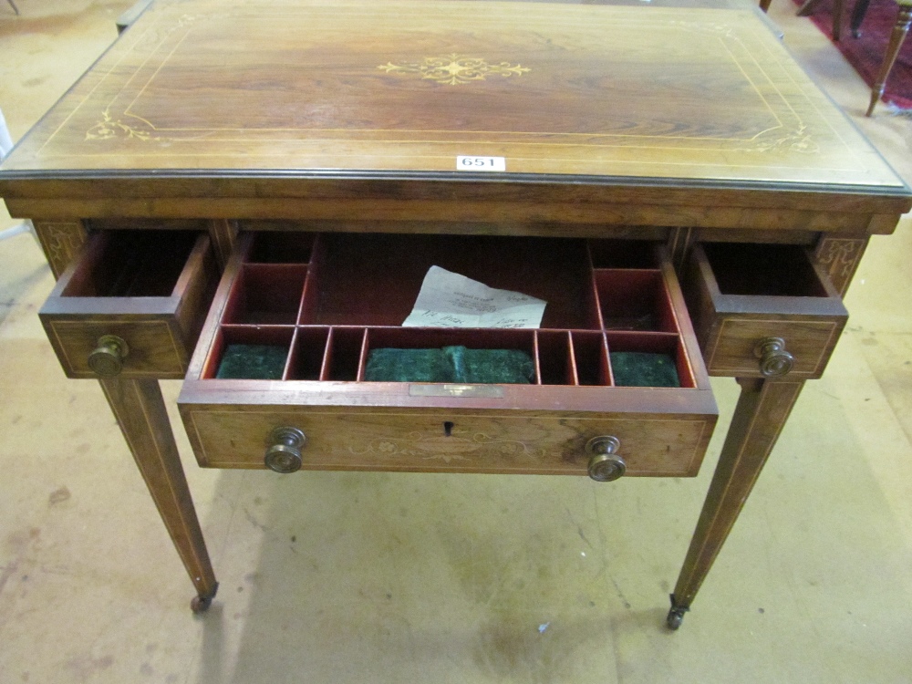 A late Victorian rosewood games/work table with a foldover top revealing backgammon, chess and - Image 2 of 5