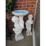 A white garden bird bath and figure (a/f)