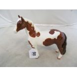 A Beswick brown and white horse