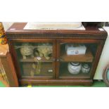 A low oak two door cabinet