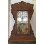 An American carved oak clock