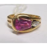 A pink sapphire and diamond stylized snake head ring