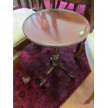 An Edwardian oval topped table with undertier and a wine table