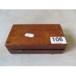 A set of weights in wooden box