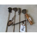 A corkscrew, caddy spoon and four African game skewers