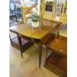 A 19th Century mahogany dropleaf pembroke table on tapered supports