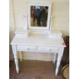 A white dressing table and mirror