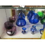 Various coloured glass including Siamese cats looking into vases