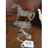 A spelter horse on wooden plinth and a small cast metal dog