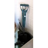 A garden fork, spade, pruners et cetera in bucket