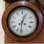 A walnut circular wall clock