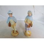 A pair of bisque figures boy and girl