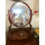 A 19th Century mahogany oval swing toilet mirror with three drawers to base