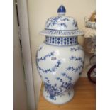 A large modern lidded blue and white vase