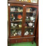 A mahogany display cabinet