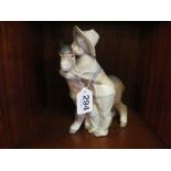 A Lladro boy with donkey