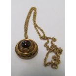 A gold locket set cabochon and chain