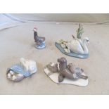 A Lladro swan and signets, Lladro duck and ducklings and two Lladro sea lion ornaments