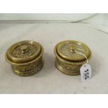 A pair of cast brass lidded boxes with liners