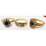 Two 18ct gold rings and another cluster ring