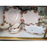 A Royal Albert Country Roses dinner/teaset sixty-two pieces (some items seconds)