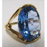 A gold ring inset blue stone, size K/L