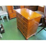 A pair of bedside chests two short and three long drawers