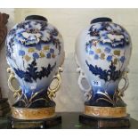 A pair of blue and gilt vases