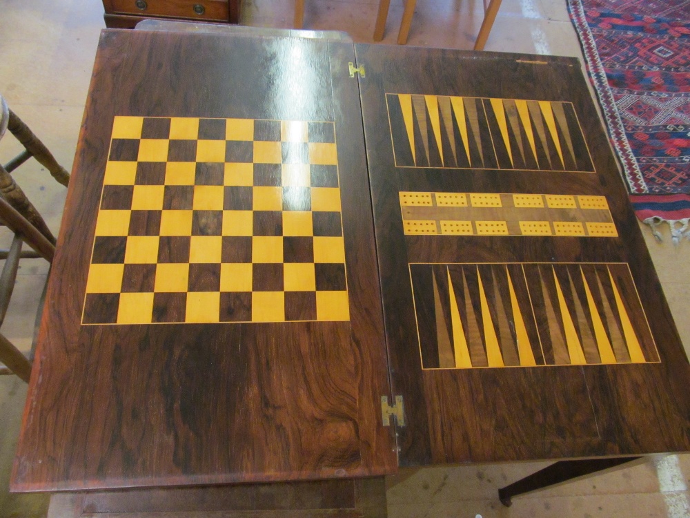 A late Victorian rosewood games/work table with a foldover top revealing backgammon, chess and - Image 3 of 5