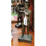 A bronze figure boy holding a twig, signed M. Debut