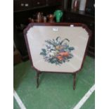 An embroidered firescreen/tip up table