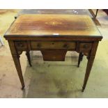 A late Victorian rosewood games/work table with a foldover top revealing backgammon, chess and