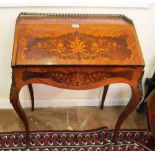 A 19th Century bureau de dame with brass gallery and floral inlaid fall front on cabriole legs