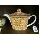 An oval teapot pink and gilt with face of lady