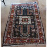 A Persian rug blue and red symmetrical design