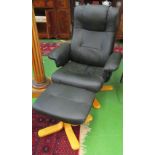 A black reclining chair and stool