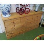 A pine chest three short and four long drawers