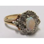 An opal and diamond cluster ring, size N