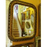 A gilt pierced frame mirror