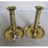 A pair of Victorian candlesticks with push-ups