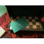 A Jacques Staunton chess set and board and vintage set of draughts