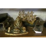 A brass inkwell man seated carving turkey, pair of bass wall candleholders and a pair of brass