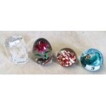 A Langham glass paperweight and three others