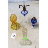 A glass scent bottle with tall stopper, yellow scent bottle the stopper etched nude diver and two