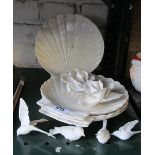 Four Belleek shell plates (a/f) and two white porcelain flower heads and birds