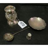 A silver mounted and glass peppermill, silver flowerhead dish, sifter spoon and a thimble